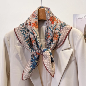 Retro floral print cotton linen scarf with orange lily patterns on beige suit