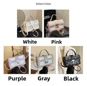 Detail view of woven square bags in five colors with metal buckles and top handles