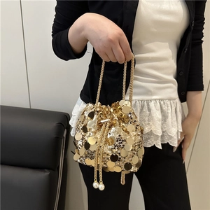 Fashionable golden sequin bucket bag with pearl drawstring and thin chain strap