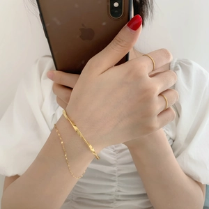 Minimalist double layered twisted chain bracelet and ring set in polished gold finish