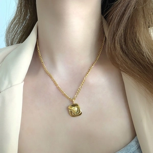 Gold plated necklace with abstract textured square pendant for elegant layering