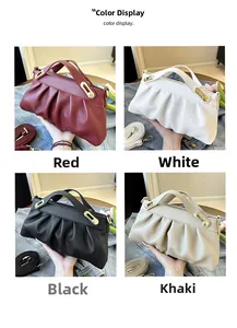 Detail view of ruched leather tote bags in red, white, black, and khaki with metal buckles