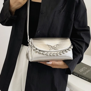 Silver metallic crossbody bag with butterfly ornament and beaded chain handle