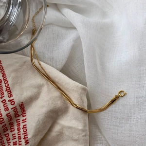 Double-layered gold snake chain necklace for women with minimalist luxury design and shine