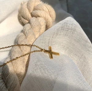 Minimalist gold cross pendant necklace with textured vertical grooves for women