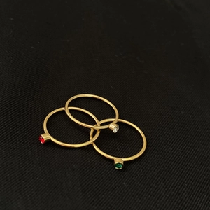 Three-piece stackable minimalist 14k gold plated rings with red, green and white stones