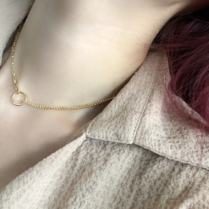 Minimalist gold-layered necklace featuring box and bead chains with a circular pendant