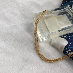 Multi-layer gold bead necklace made of titanium steel for women in a vintage minimalist style