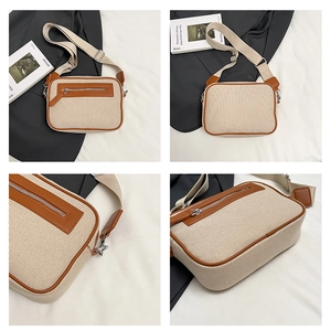 Dettaglio borsa quadrata in tela con finiture in pelle e tracolla larga regolabile