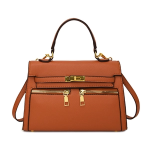 Klassieke oranjebruine trapezium handtas met gouden hardware en litchi lederen textuur