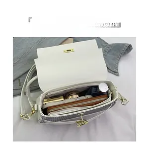 Top view of white crossbody bag interior showing spacious compartments and storage capacity