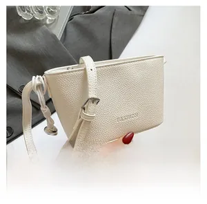 Detailed macro view of white lychee pattern leather texture and FASHION embossed text