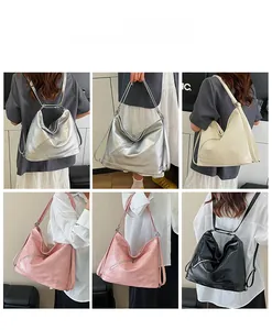 Detail view of versatile tote bag in silver, cream, pink, and black textured PU leather