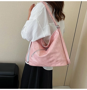 Pink oversized tote bag in glossy oil wax leather finish with silver zipper details