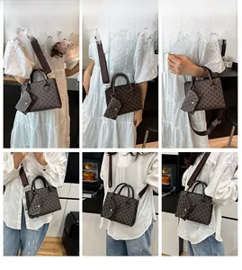 Detail view of vintage brown monogram mini tote bag with adjustable crossbody strap