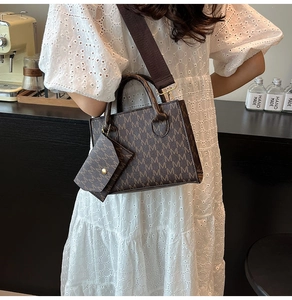 Detailed shot of retro mini tote bag with letter print and detachable coin purse accessory