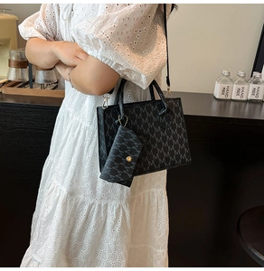 Detail of printed tote bag with matching envelope pouch and black shoulder strap