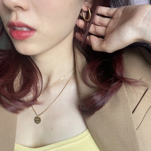 Vintage oval gold hoop earrings and necklace set with Good Luck engraved pendant on model