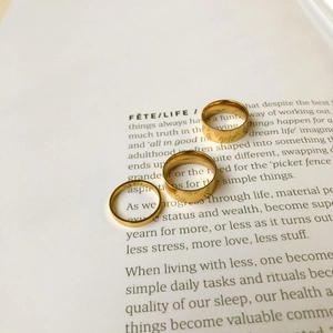 Three-piece gold plated stainless steel ring set with minimalist engraved patterns