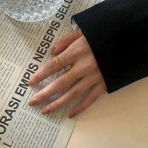 Layered gold vintage cross wrap rings for women in a minimalist elegant style