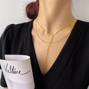 Élégant ensemble de colliers dorés à deux couches en Y avec une chaîne tissée minimaliste
