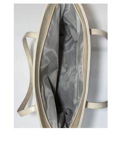 Detail view of large tote bag interior with grey chevron lining and zipped pocket
