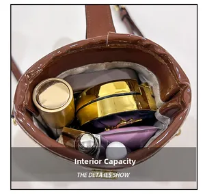 Internal capacity of the shiny faux leather bucket bag showing makeup storage space