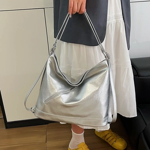 Silver metallic tote bag with pleated texture and versatile double straps design
