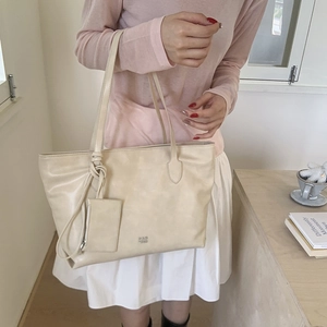 Chic beige large capacity tote bag with matching pouch and soft faux leather texture