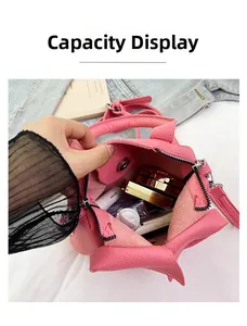 Pink litchi grain leather bag showing interior capacity for phone and cosmetics