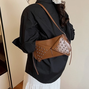 Brown punk rivet underarm bag with silver studs and polished faux leather finish