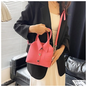 Pink shirt-shaped crossbody bag with lychee grain faux leather texture and button detail