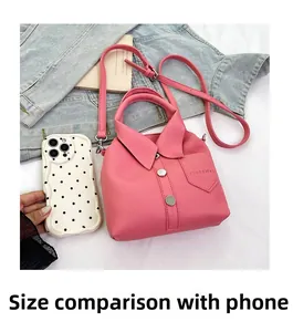 Detail of pink lychee texture shirt-style handbag with size comparison next to phone