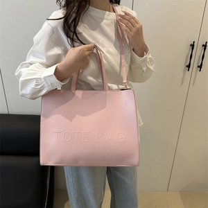 Pink minimalist large capacity tote bag with embossed lettering and shoulder strap