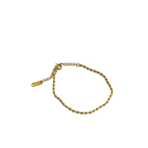 Minimalist gold titanium steel bracelet featuring oval beads and a K18 engraved tag