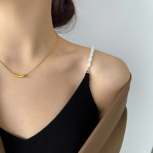 Minimalist gold smile curved tube necklace on snake bone chain with chic aesthetic charm