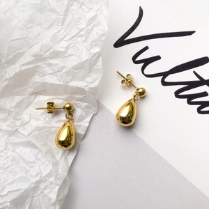 Polished gold teardrop stud earrings for women in a minimalist metallic fashion design