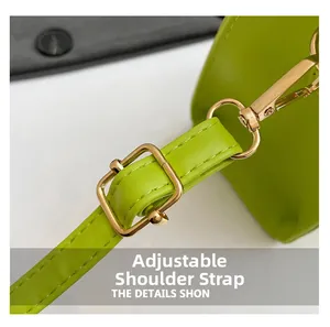 Close-up of adjustable neon green textured leather strap with gold buckle and metal clasp