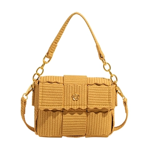 Chic mustard yellow woven crossbody bag with wave edge flap and gold flower buckle