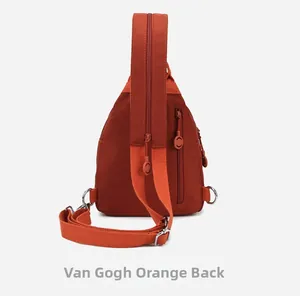Detail view of Van Gogh orange oxford mini backpack with convertible zip straps