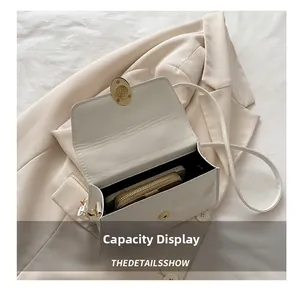 Internal view showing capacity for a phone and wallet in the beige PU leather bag
