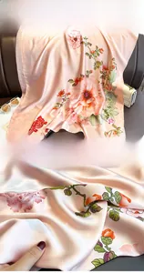 Detail shot of vintage silk scarf featuring pink peony print and fine edge stitching