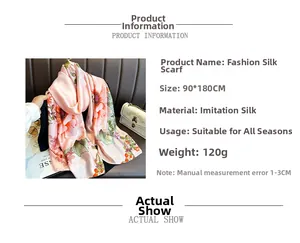 Detail of pink floral silk shawl with vibrant orange flower prints and soft texture