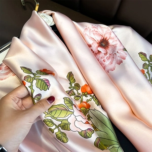 Pink satin scarf with floral peony print featuring a smooth glossy finish and soft drape