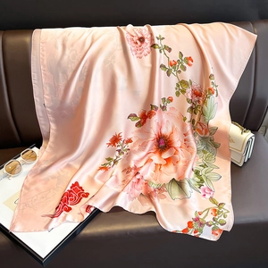 Elegant floral print silk scarf with large peonies and traditional clouds on a peach base