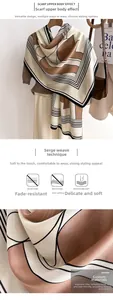 Detailed view of striped geometric scarf made of soft faux sheep wool polyester fabric