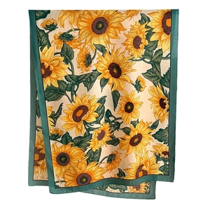 Fashionable silk scarf featuring yellow sunflower prints with green border detail