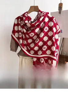 Polished scarf detail with red and white polka dots and floral motif on coat hanger