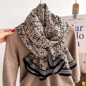Elegant beige shawl with black floral rose pattern and geometric borders for autumn wear