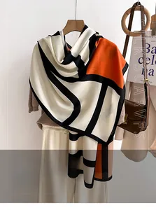 Detail of soft imitation sheep wool scarf with geometric color-block and letter patterns